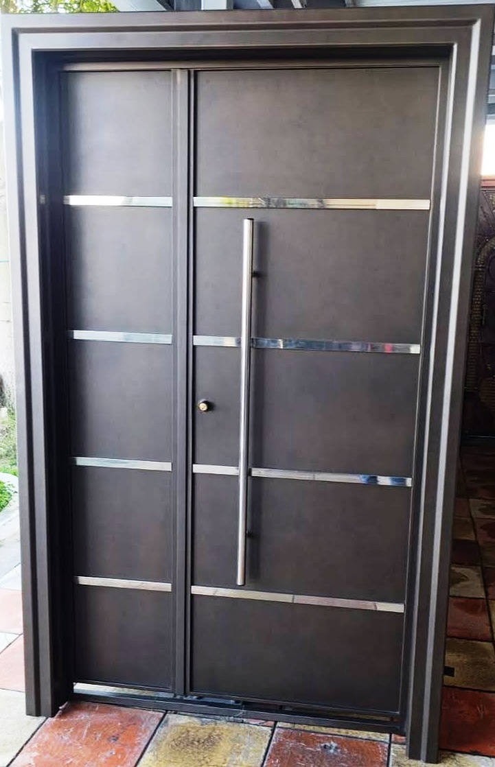 Metallic entry door installed at a home entrance in Tunisia